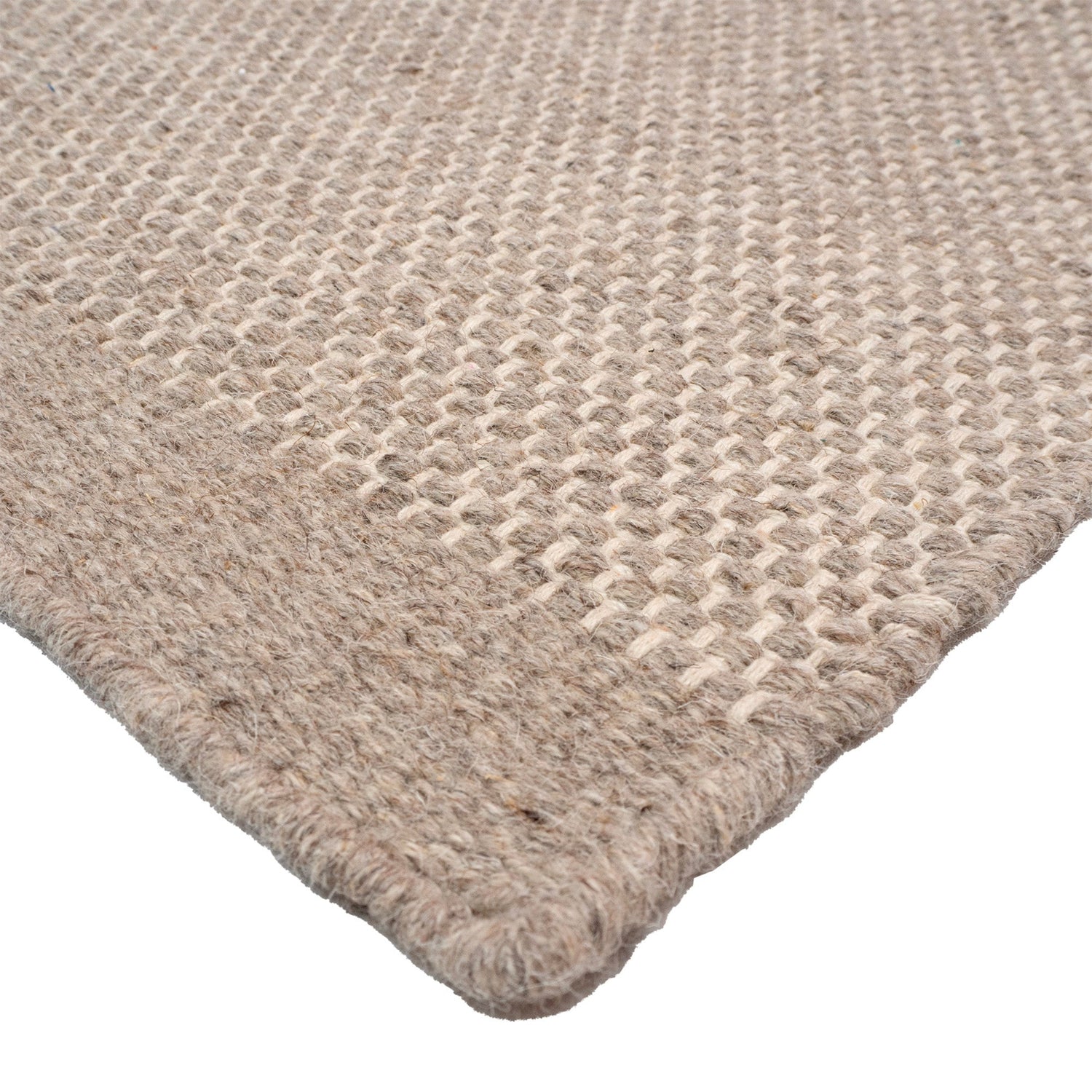 Lähikuvassa Aamu-villamatto vaaleanharmaalla kuosilla.