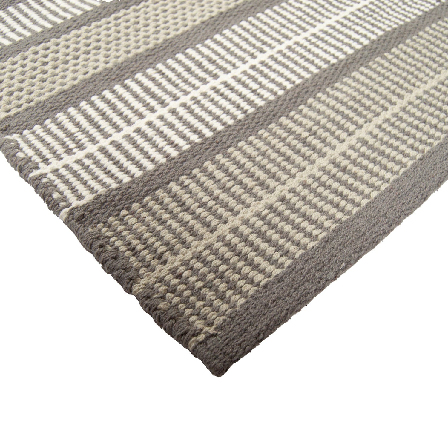 Lähikuvassa Foksi-puuvillamaton harmaan sävyistä pintaa.