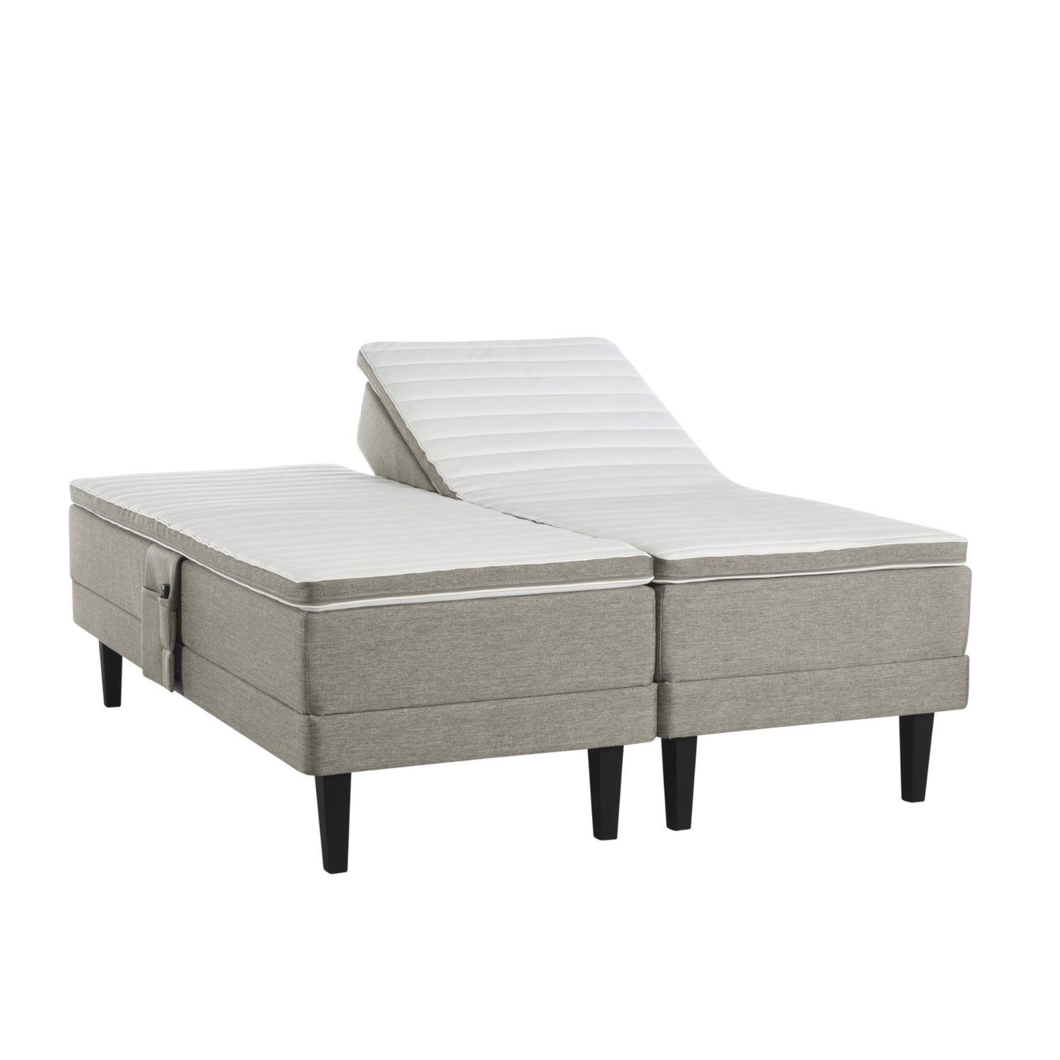 Hiekanvärinen Havu-moottorisänky wengen värisillä Royal-jaloilla ja profiloiduilla sijauspatjoilla. Kuvan tarviketasku myydään erikseen.