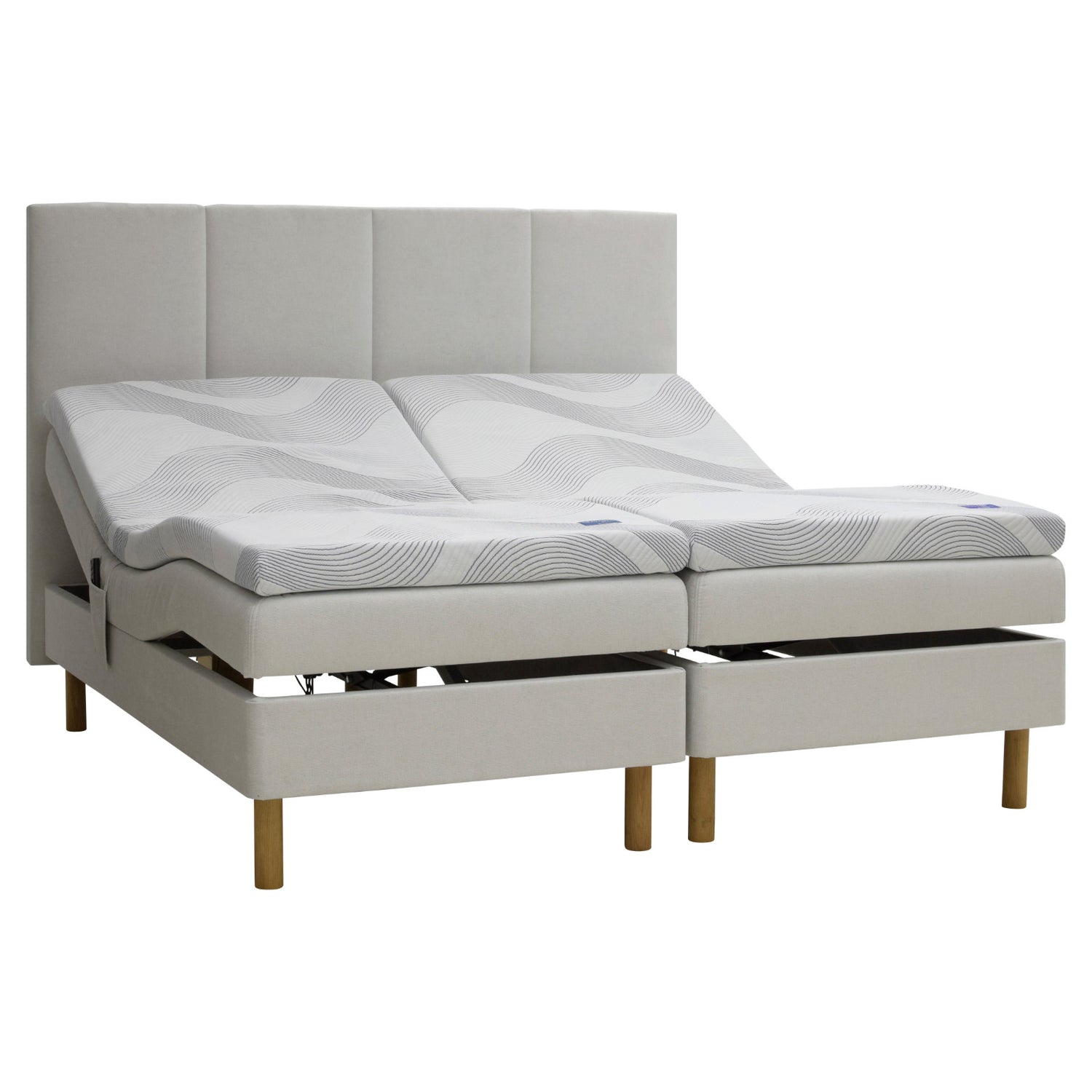 Beige Tunnel 01 -kangasverhoiltu Heaven By Unico Revive -moottorisänkypaketti. Pakettiin kuuluu 2 kpl Suomessa valmistettua, portaattomasti säädettävää Revive-moottorisänkyä, 2 kpl Revive 8 Nano Cool™-verhoiltua Memory -ergosijauspatjaa sekä pyöreät tammenväriset puujalat. Kuvan sängynpääty myydään erikseen.