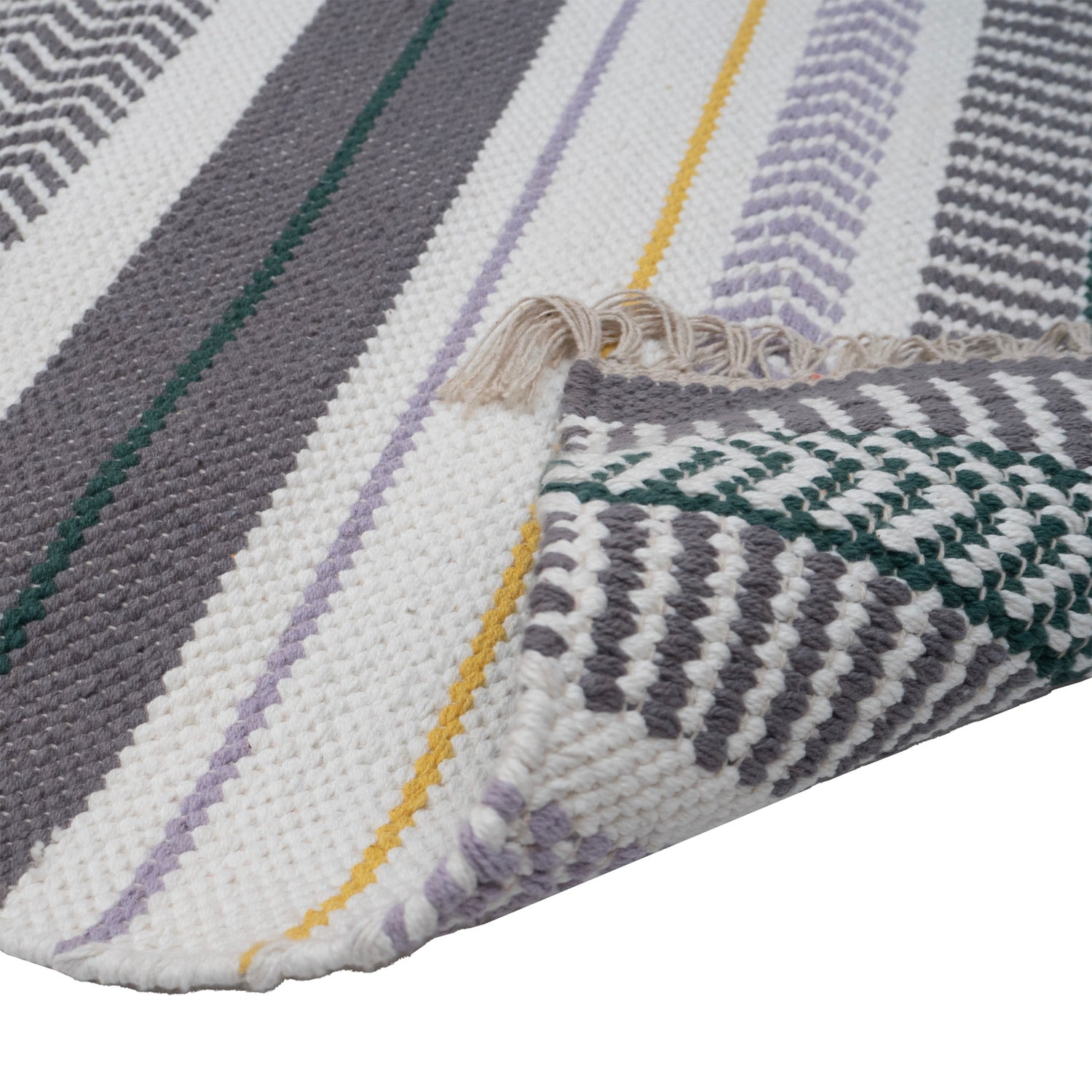 Lähikuvassa Leimu-maton pohja tummanharmaalla kuosilla.