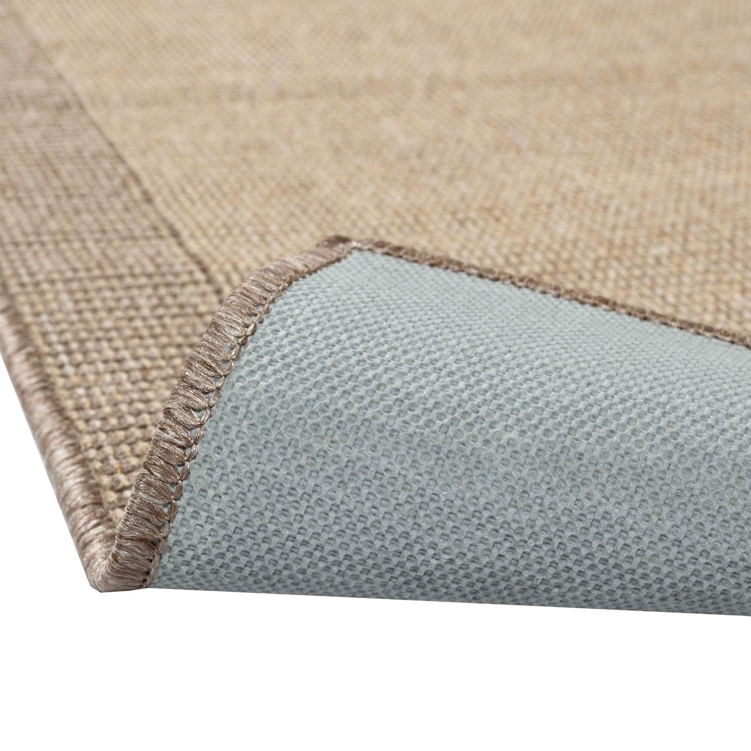 Sileäksi kudottu Lino-matto, beige. Kuvassa näkyy maton pohjaus.