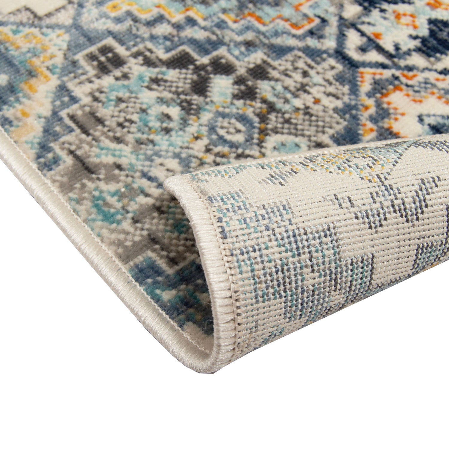 Lähikuvassa Nimar-nukkamaton lyhytnukkainen sinisävyinen monivärinen kuosi ja pohjausta.