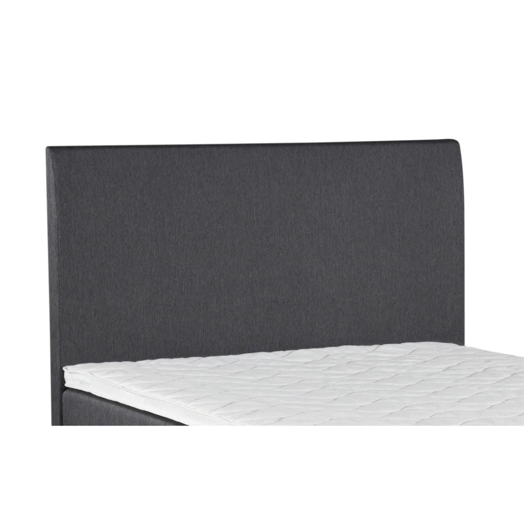 Sängynpäädyssä on sama verhoilu, kuin Aalto- ja Ranta-mallistojen patjoissa. Kuvassa harmaa väri.