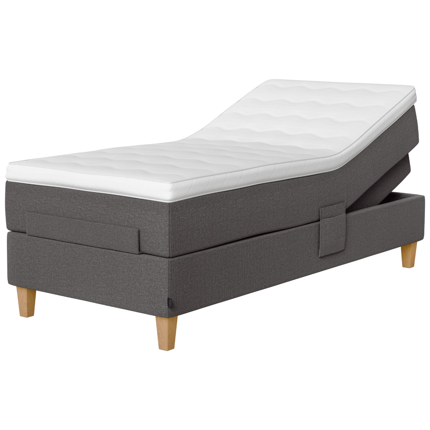 Jensen Onyx -säätösängyn harmaa Grey 173 verhoiluväri ja nelikulmaiset 23 cm korkeat luonnonväriset tammijalat. Yhtenäinen TempSmart -sijauspatja ja jalat sisältyvät hintaan.