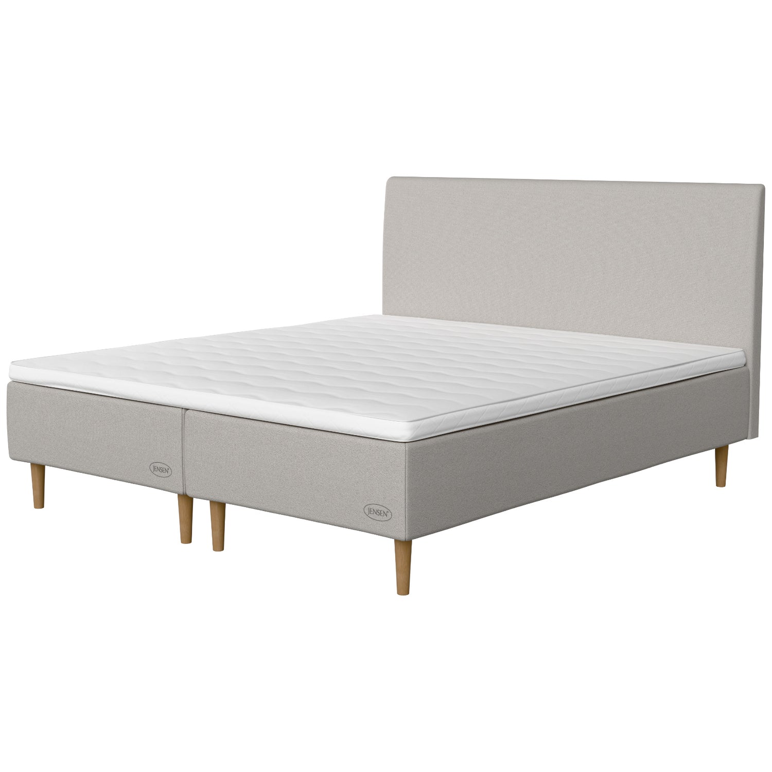 Jensen Opal -runkopatjasängyn vaaleanharmaa Light Grey 186 -verhoilu ja luonnonväriset 18 cm korkeat Conic-tammijalat. Yhtenäinen sijauspatja ja jalat sisältyvät hintaan. Jensen-sängynpääty myydään erikseen.