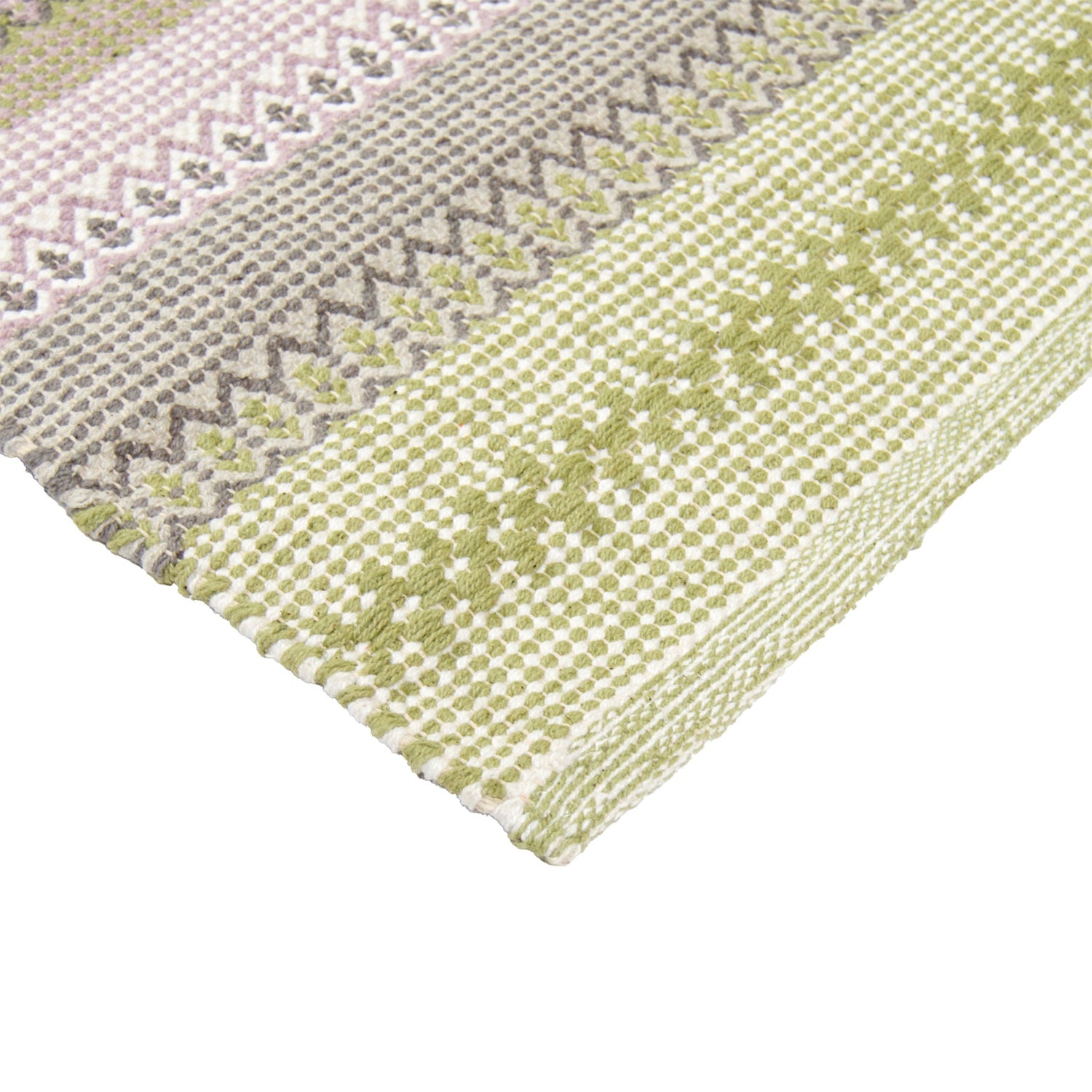 Polkka-puuvillamatto, lähikuvassa keltaisen sävyinen vihreä-keltainen väri.