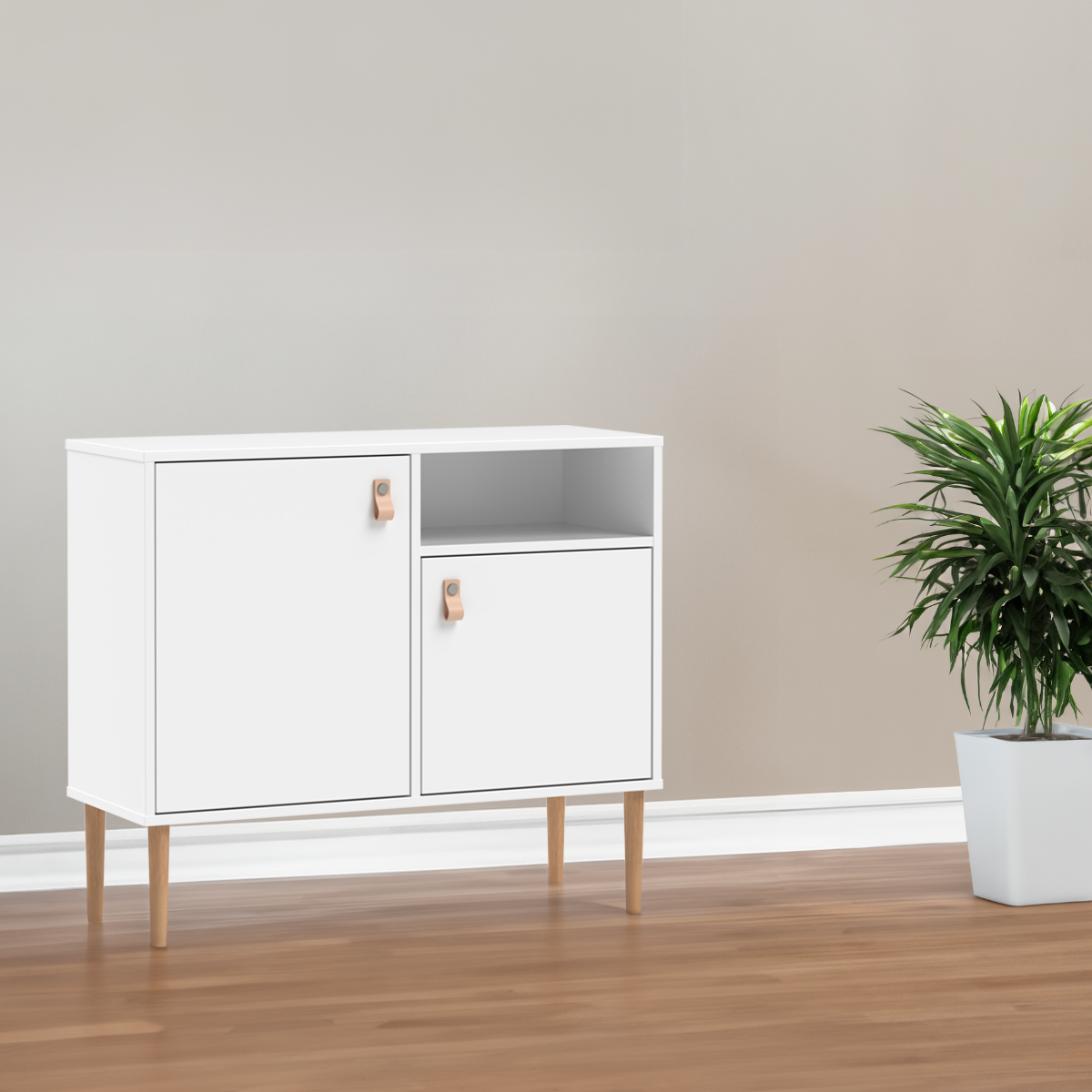 Kuvassa on kokovalkoinen Stemma-lipastokaappi lv-tammijaloilla ja nahkavetimillä.