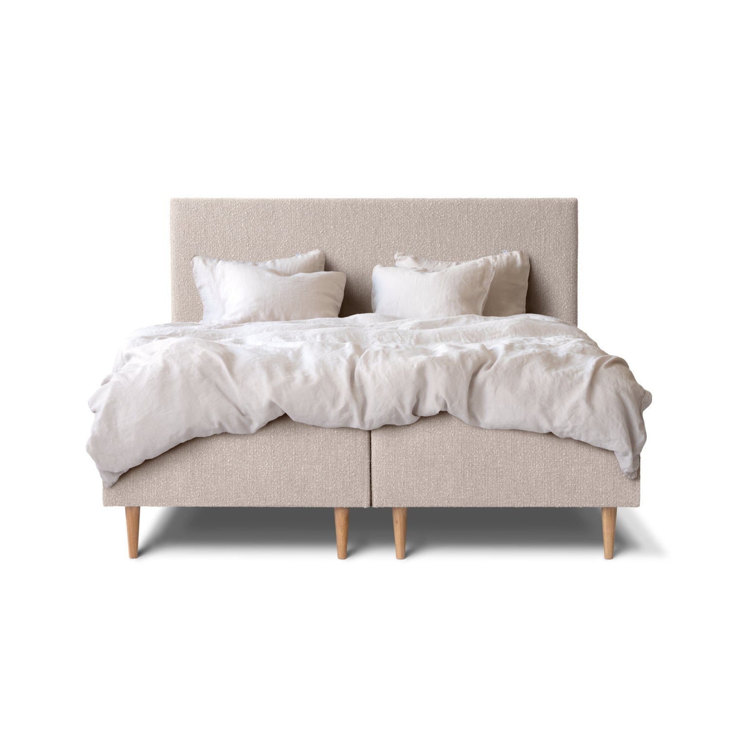 Tempur Break Box -runkosänkypaketti beigellä verhoilulla ja tammijaloilla. Kuvan Tempur Break Classic -sängynpääty ja petivaatteet myydään erikseen.