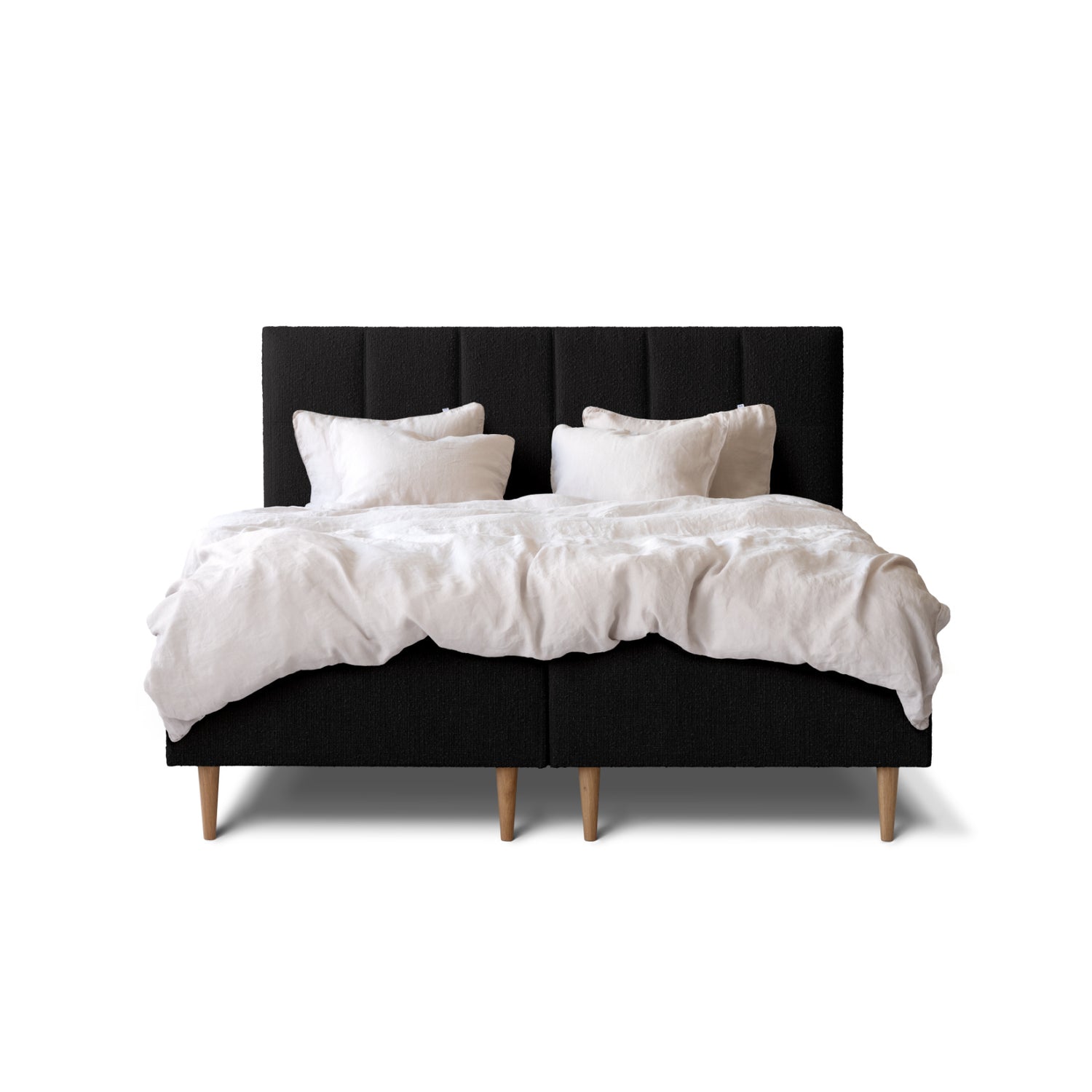 Tempur Break Box -runkosänkypaketti mustalla verhoilulla ja tammijaloilla. Kuvan Tempur Break Square -sängynpääty ja petivaatteet myydään erikseen.