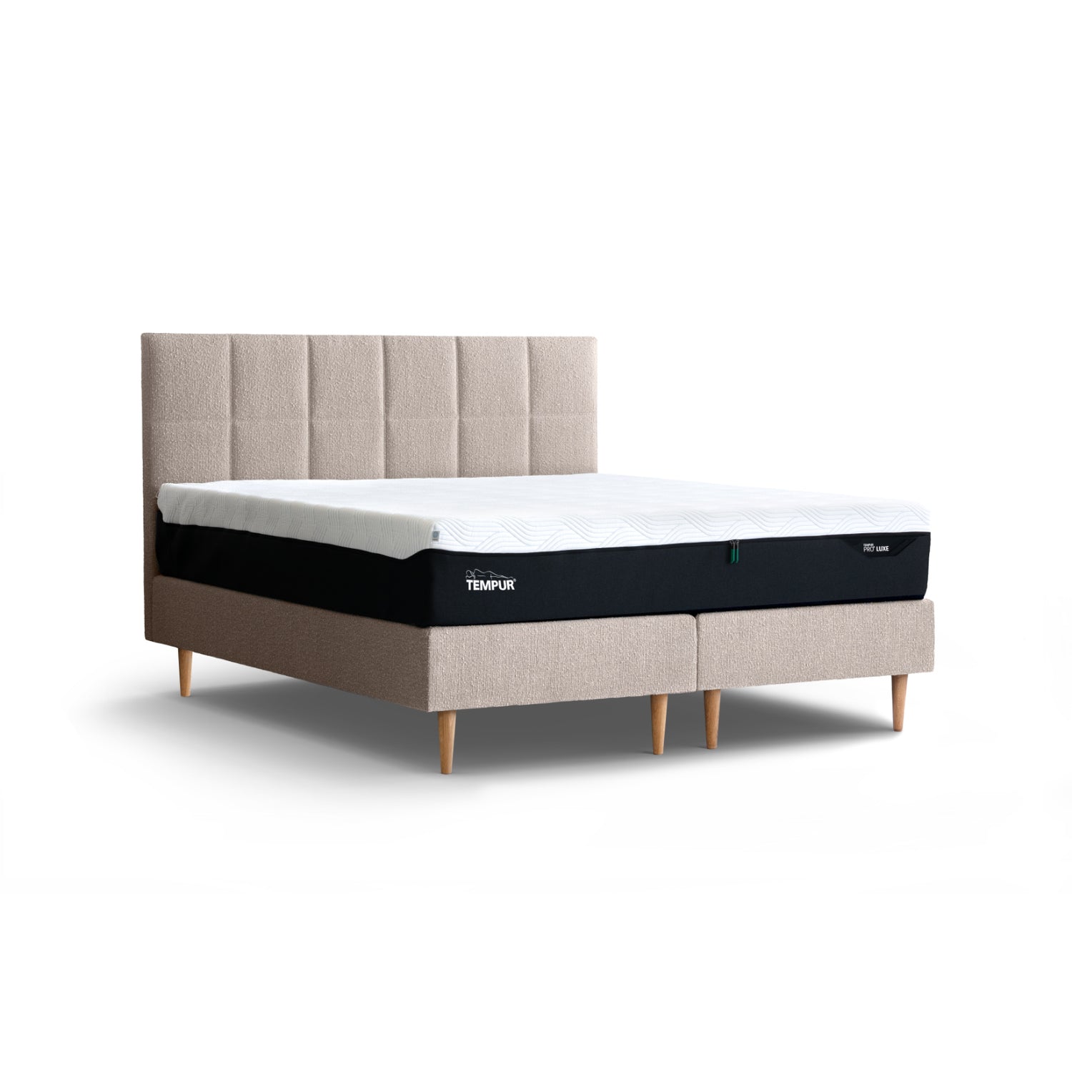 Kuvassa on Tempur Break Continental -jenkkisänky beigenvärisellä verhoilulla ja tammijaloilla. Kuvan Tempur Break Square -sängynpääty myydään erikseen.