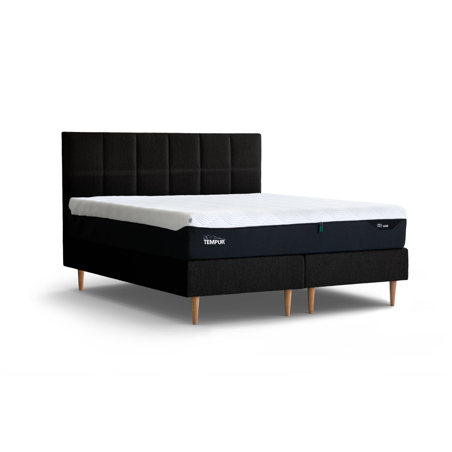 Kuvassa on Tempur Break Continental -jenkkisänky mustalla verhoilulla ja tammijaloilla. Kuvan Tempur Break Square -sängynpääty myydään erikseen.