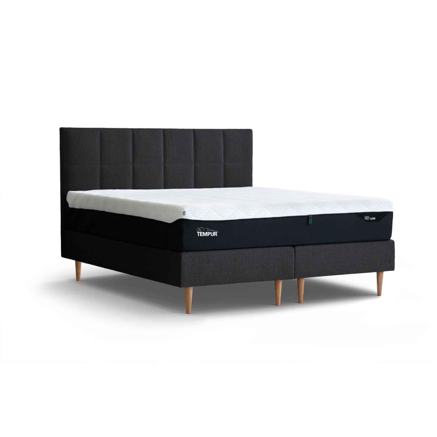 Kuvassa on Tempur Break Continental -jenkkisänky grafiitinvärisellä verhoilulla ja tammijaloilla. Kuvan Tempur Break Square -sängynpääty myydään erikseen.