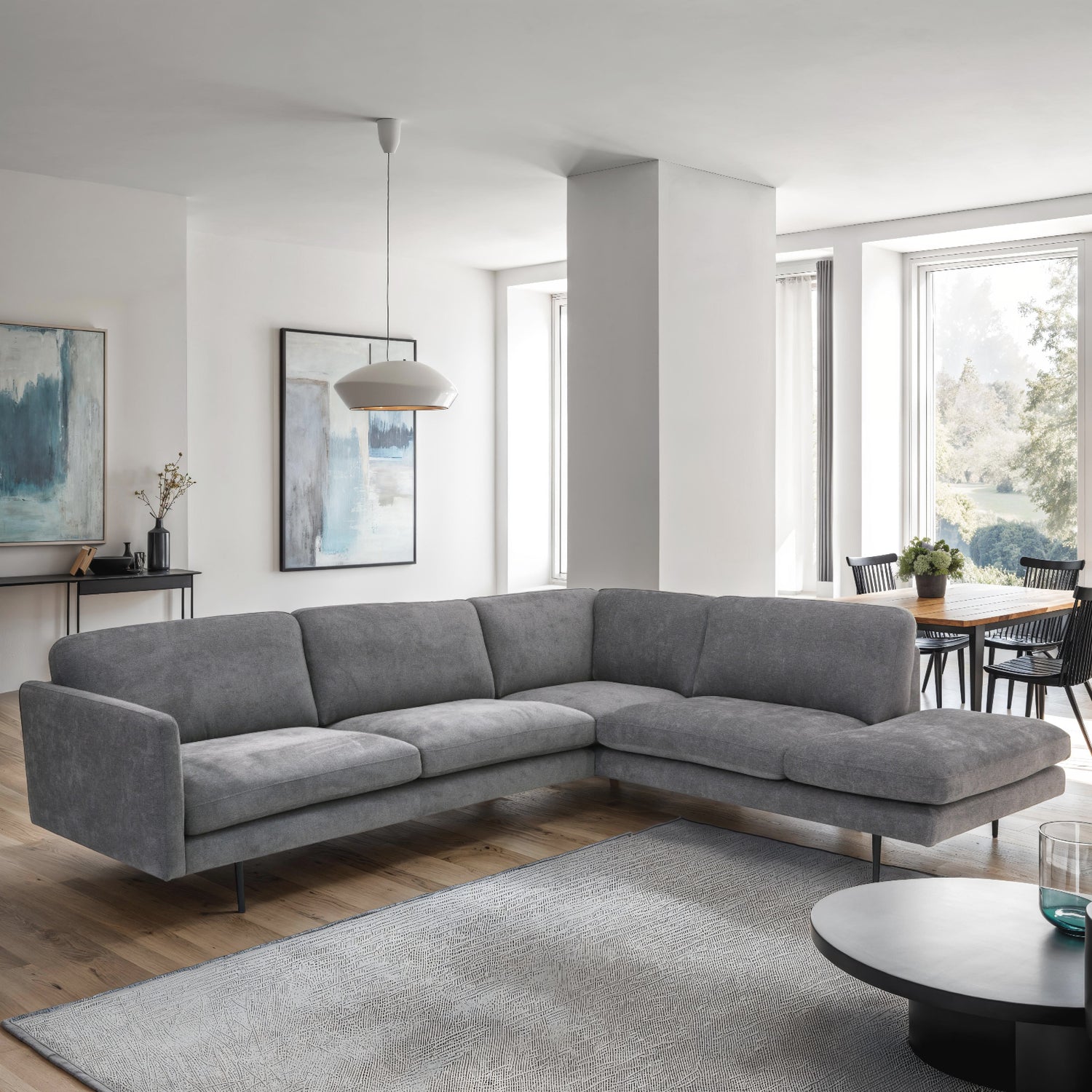 Kuvassa on Ystad-kulmadivaani harmaala Cloud 97 -kangasverhoilulla ja mustilla metallisilla jaloilla.