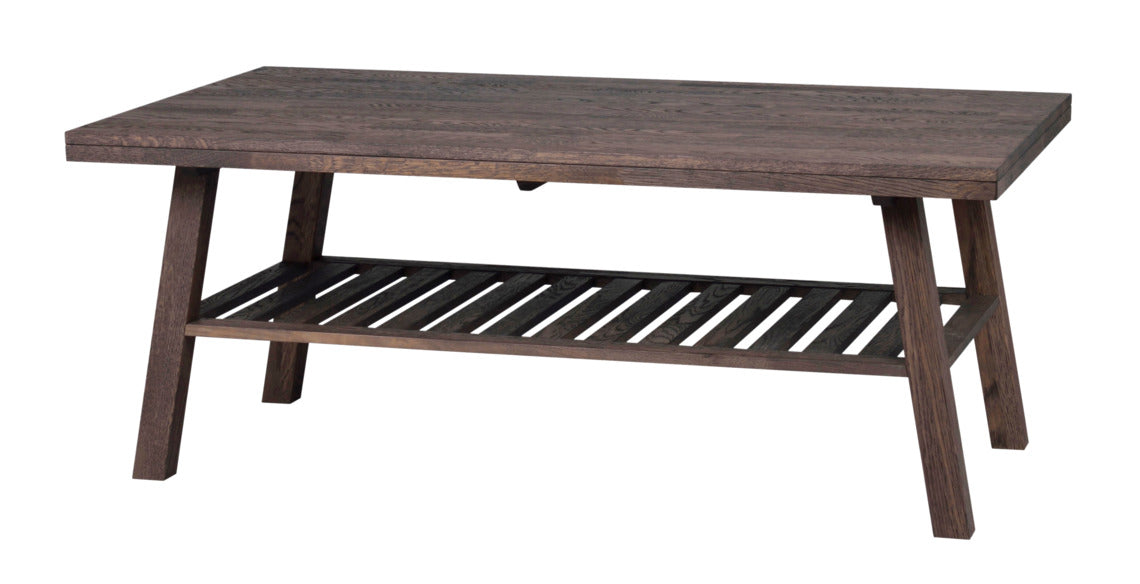 Tummissa Brooklyn-kalusteissa on harjattu pinta ja viimeistelynä sävytelakka. Kuvan sohvapöytä on savutammenvärinen.