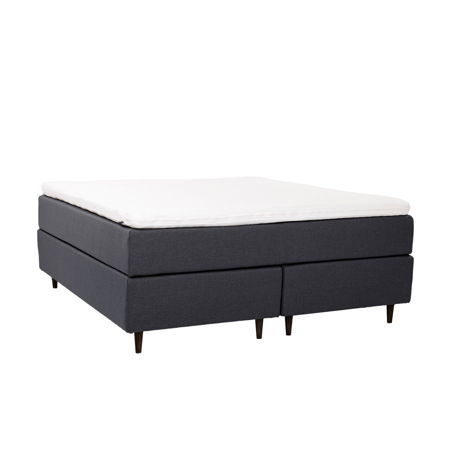 Antrasiitinvärinen Hilding Cross -jenkkisänky tummanruskeilla pyöreillä Hilding Raita -tammijaloilla ja yhtenäisellä Ergo -sijauspatjalla.