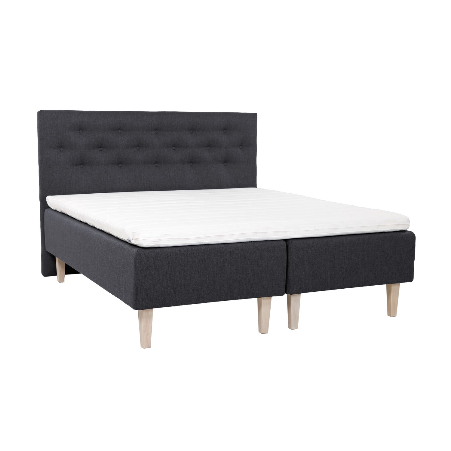Antrasiitinväriset Hilding Feel Ergo -runkopatjat 90 x 200 cm valkolakatuilla 23 cm korkeilla Royal -tammijaloilla ja yhtenäisellä Hilding Ergo -sijauspatjalla. Kuvan Feel -sängynpääty myydään erikseen.