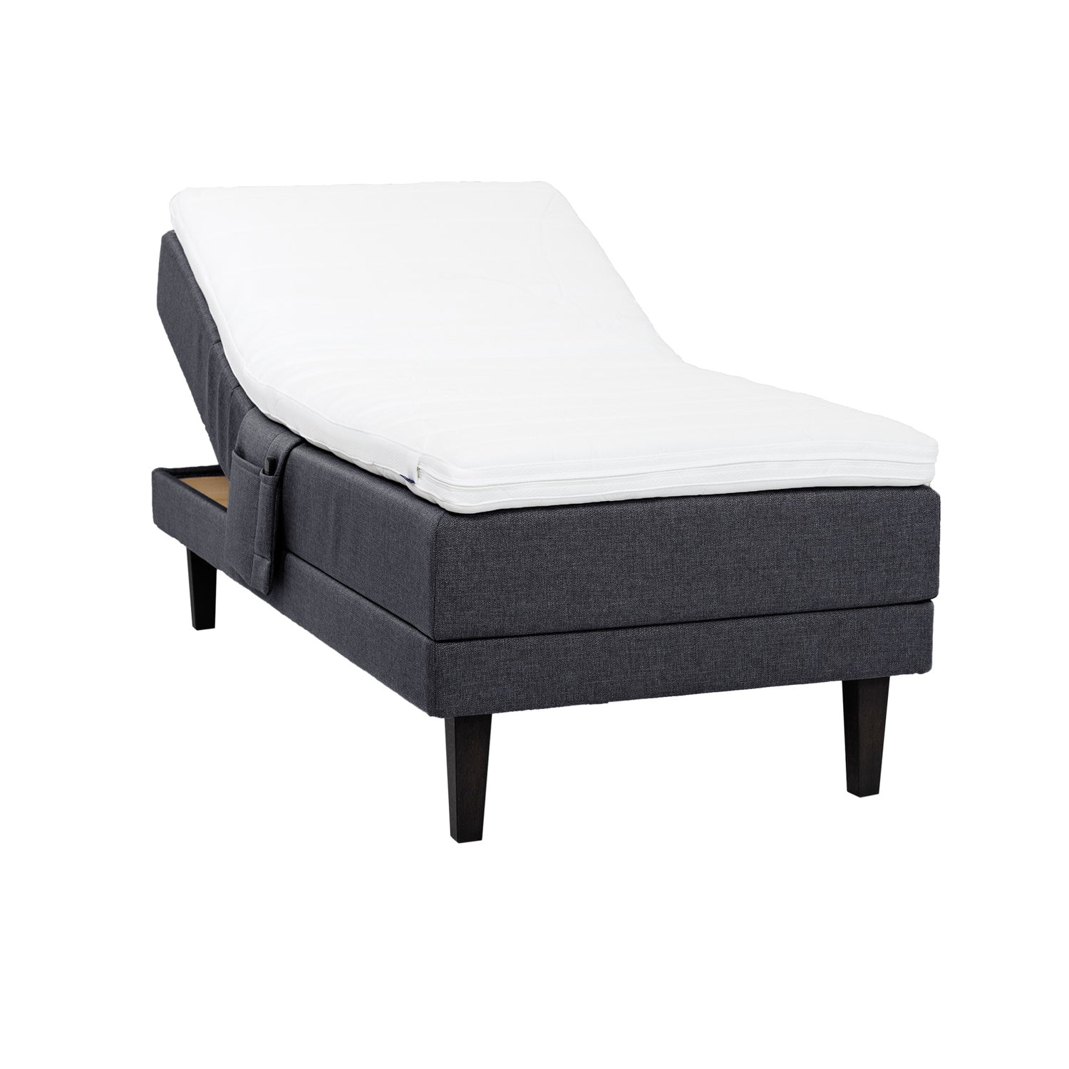 Antrasiitti Hilding Feel -moottorisänky 90 x 200 cm hiilenmustilla 23 cm Royal-tammijaloilla ja Hybrix Air Coolmax -sijauspatjalla. Kuvan tarviketasku myydään erikseen.