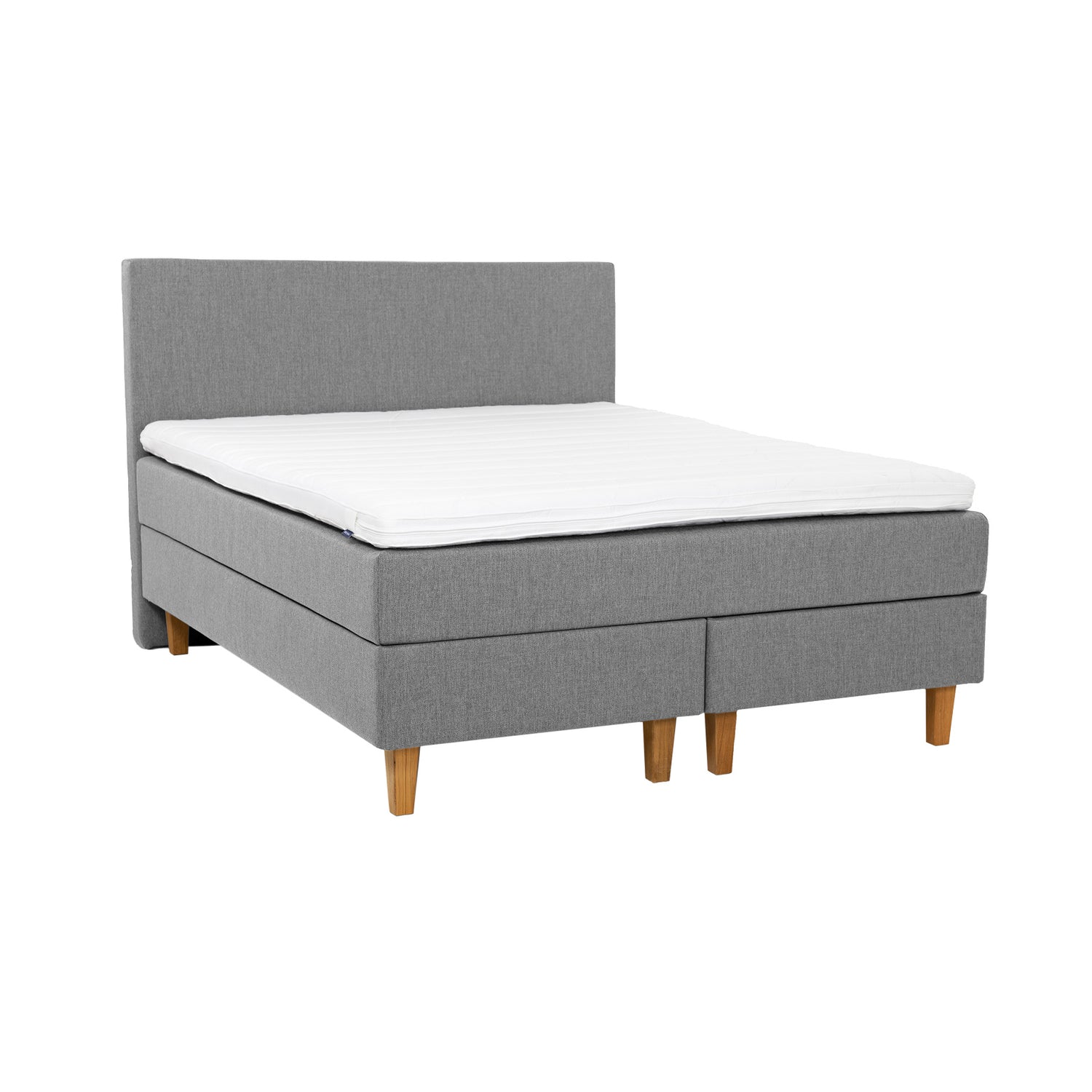 Harmaa Hilding Original Solid -jenkkisänky 160 x 200 cm luonnonvärisillä 18 cm korkeilla Royal-tammijaloilla ja yhtenäisellä profiloidulla kimmovaahtosijauspatjalla. Kuvan Original -sängynpääty myydään erikseen.