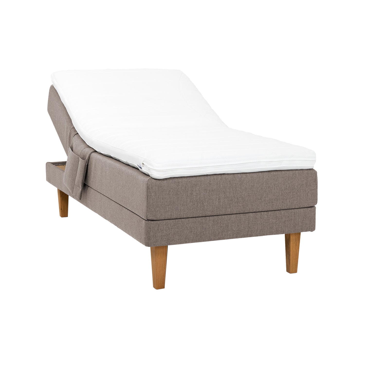 Hiekanvärinen Hilding Original -moottorisänky 80 x 200 cm luonnonvärisillä 23 cm korkeilla Royal -tammijaloilla ja profiloidulla kimmovaahtosijauspatjalla. Kuvan tarviketasku myydään erikseen.
