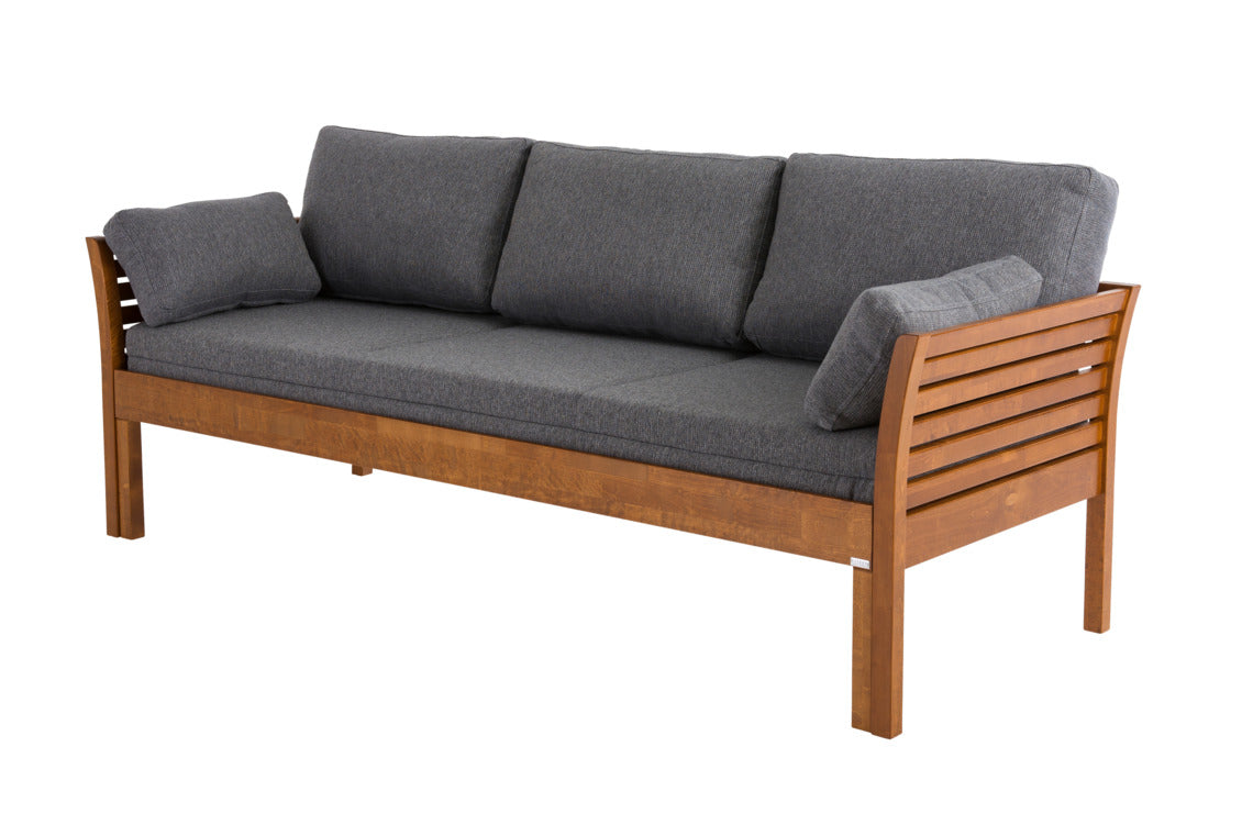 Pähkinänvärinen Kanerva- vuodesohva ja harmaa Levon-taittopatjasarja. Patjasarja myydään erikseen.