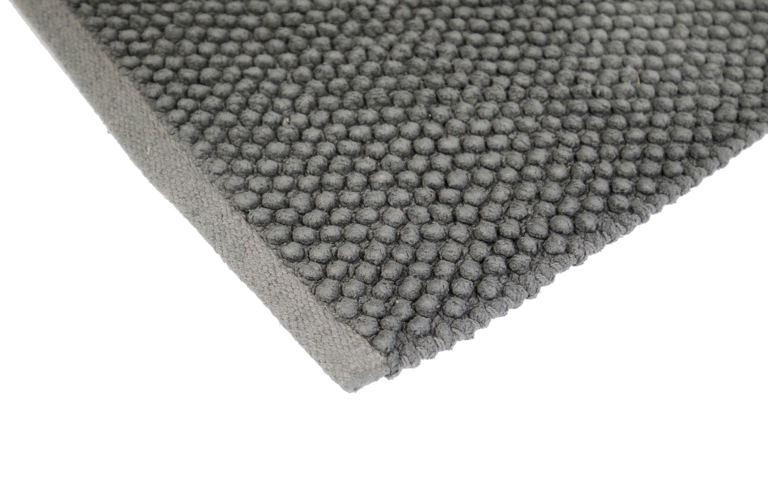 Pehmeä Olivia-matto tummanharmaana. Puuvillamatossa on pampulapinta ja liukumaton pohja.
