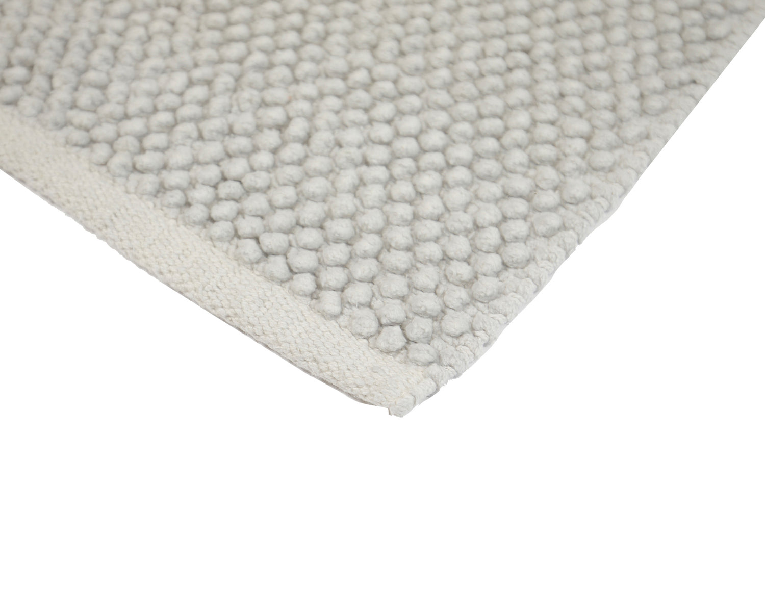 Pehmeä Olivia-matto vaaleanharmaana. Puuvillamatossa on pampulapinta ja liukumaton pohja.