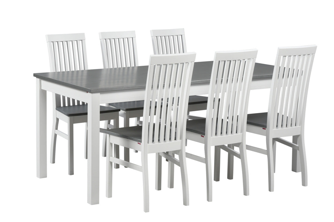 Valkoinen Petra-ruokailuryhmä harmaaksi petsatuilla pöydän kannella ja istuimilla. Petra-ruokapöydän koko on 175 x 90 cm.
