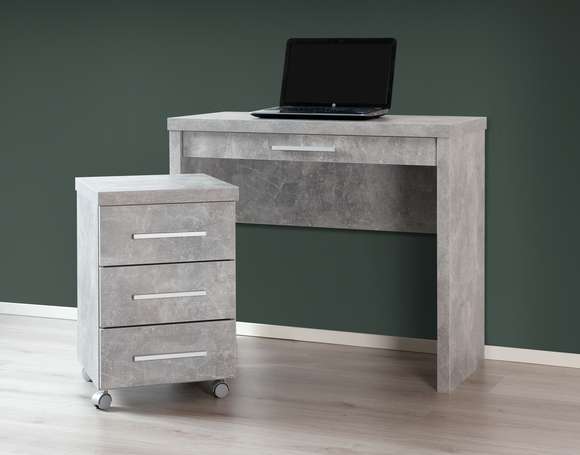 Shape-sarjan kapea työpöytä laatikolla, sekä laatikosto. Kuvan työpisteen kalusteet ovat harmaan betoninvärisiä.