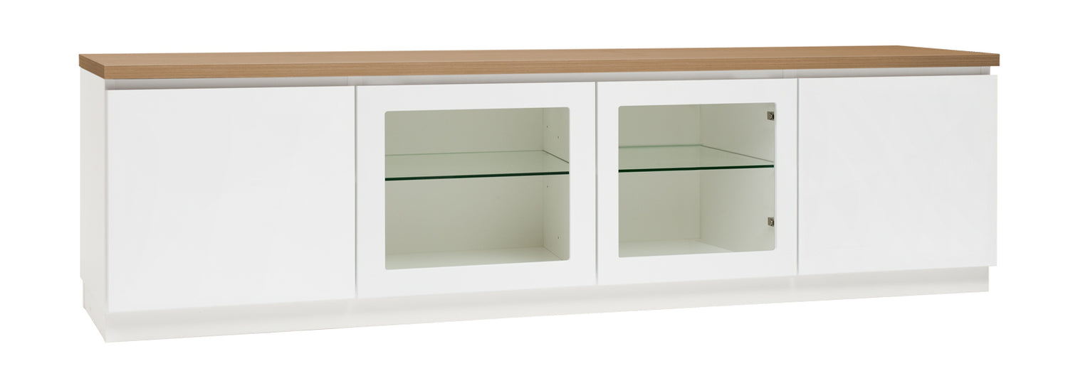 Kuvassa on 184 cm leveä valkoinen Viiva-sarjan tv-taso tammenvärisellä kannella ja valkoisella jalkasokkelilla. Kuvasta poiketen tasossa on keskellä yhtenäinen tila ilman väliseinää, 88 cm leveällä lasihyllyllä.