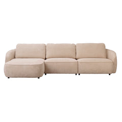 Vaalean beige Norris-divaanisohva vasemmanpuoleisella divaanilla. Sohva on verhoiltu Chenillen kaltaisella Anna 2-kankaalla ja sohvassa on mustat 5 cm korkeat jalat.