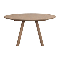 Pyöreä Clapperton ruokapöytä hiekkatammenvärisenä.