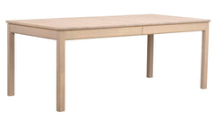 Valkotammenvärinen Gardner-ruokapöytä.