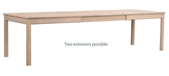 Valkotammenvärinen Gardner-ruokapöytä jatkettuna kahdella erikseen myytävällä jatkolevyllä, yht. 3 m.
