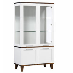 Valkoinen Vuokatti-vitriini, tumman pähkinänvärisillä kansiosilla ja jalkaosalla. Vitriinissä on lasikaappi lasihyllyillä, peilipuuovet sekä pitkänmalliset vetimet.