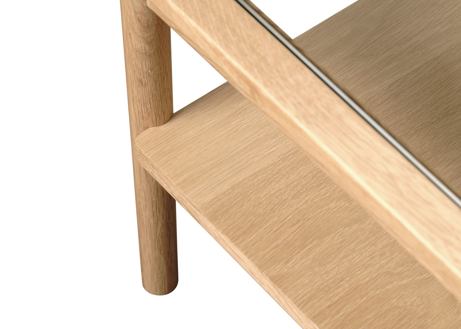 Lähikuvassa Elba-sohvapöydän lasikansi ja luonnonväristä pintaa.