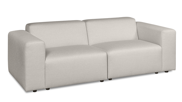 Vaalea Alma-sohva kangasverhoiltuna Minco 2 -kankaalla. Kuvan sohvassa on mustat muovijalat.
