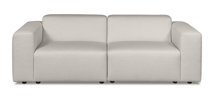 Vaalea Alma-sohva kangasverhoiltuna Minco 2 -kankaalla. Kuvan sohvassa on mustat muovijalat.