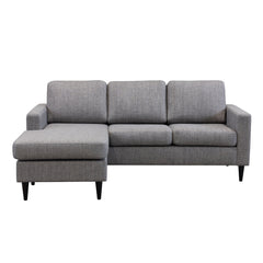 Ancona L 3FS -divaanisohva koottuna vasemmanpuoleisella divaanilla (divaani käännettävissä). Sohva on verhoiltu harmaanruskealla Tuuru Basic 489 -kankaalla ja siinä on mustat puujalat.