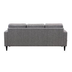 Ancona L 3FS -divaanisohva vasemmanpuoleisella divaanilla. Sohva on verhoiltu harmaanruskealla Tuuru Basic 489 -kankaalla ja siinä on mustat puujalat.