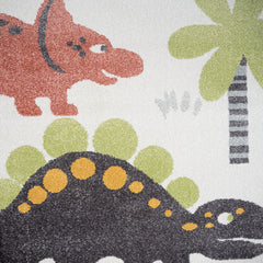 Valkoinen Dinokaverit-matto värikkäillä dinoilla.