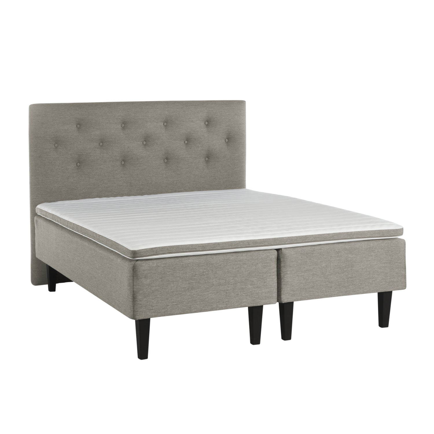 Hiekanvärinen Havu-runkopatjasänky wengen värisillä Royal-jaloilla ja yhtenäisellä profiloidulla sijauspatjalla. Kuvan sängynpääty myydään erikseen.