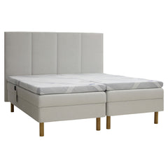 Kuvassa on beige Tunnel 01 -kangasverhoiltu Heaven By Unico Revive -moottorisänkypaketti. Pakettiin kuuluu 2 kpl Suomessa valmistettua, portaattomasti säädettävää Revive-moottorisänkyä, 2 kpl Revive 8 Nano Cool™-verhoiltua Memory -ergosijauspatjaa sekä pyöreät tammenväriset puujalat. Kuvan sängynpääty myydään erikseen.