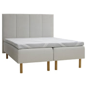 Kuvassa on beige Tunnel 01 -kangasverhoiltu Heaven By Unico Revive -runkosänkypaketti. Pakettiin kuuluu 2 kpl Revive-runkopatjaa ja yhtenäinen Revive 8 Nano Cool™-verhoiltu Memory -ergosijauspatjaa sekä pyöreät tammenväriset puujalat. Kuvan sängynpääty myydään erikseen.