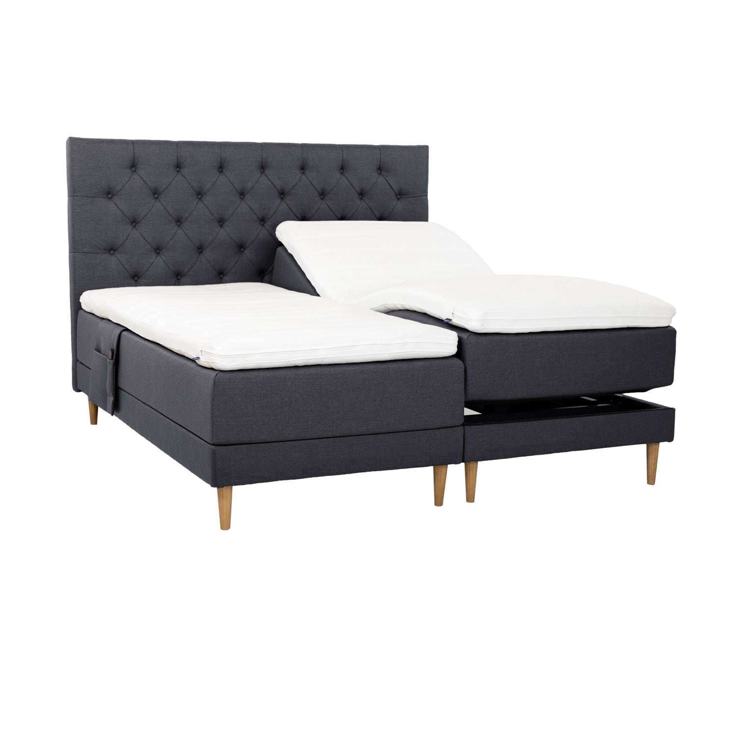 Antrasiitinväriset Hilding Cross -moottorisängyt tammenvärisillä Hilding Raita -tammijaloilla, erillisillä Hilding Ergo -sijauspatjoilla ja Hilding -tarviketaskulla.