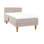 Beige Hilding Original -moottorisänky luonnonvärisillä 23 cm korkeilla Royal -tammijaloilla ja profiloidulla kimmovaahtosijauspatjalla. Kuvan sängynpääty ja tarviketasku myydään erikseen.