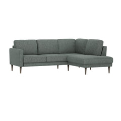 Ilona -kulmadivaanisohva tummanvihreällä AC Laviano 395 -kankaalla ja 18 cm korkeilla wengenvärisillä pyöreäkartio-jaloilla. Kuvan sohvassa on 10 cm leveä KN10-käsinoja.