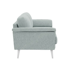 Ilona-sohva jäänharmaan/mintun värisellä AC Naomi 347 -kankaalla ja valkoisilla 18 cm korkeilla vinoilla pyöreäkartiojaloilla.  Kuvan sohvassa on 17 cm leveät KNT-käsinojat.