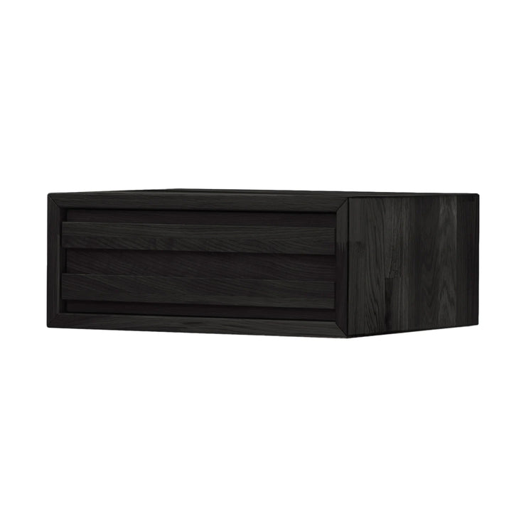 Musta Eicon Wall -yöpöytä. Seinään kiinnitettävässä yöpöydässä on vetolaatikko.