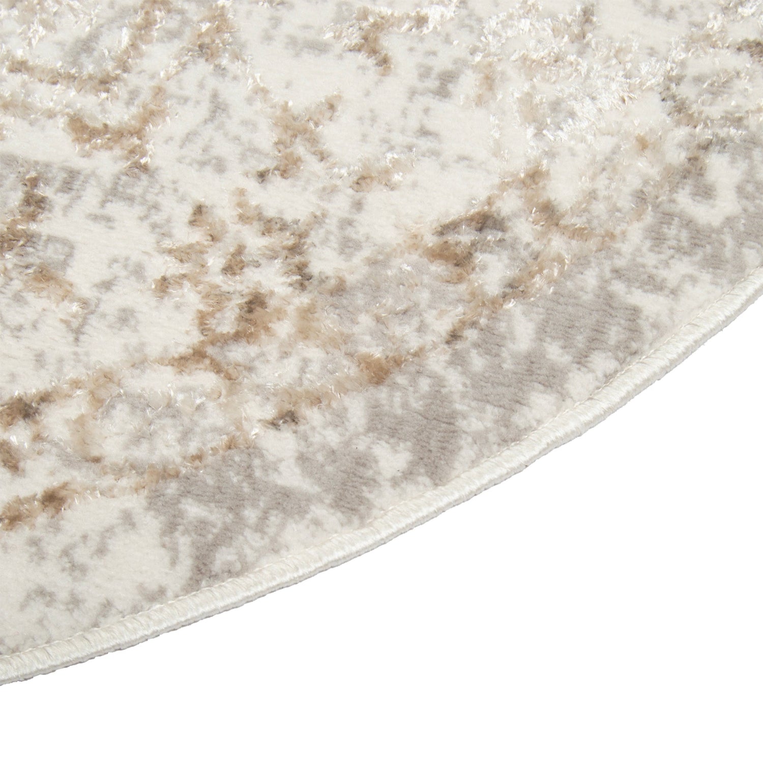 Lähikuvassa on pyöreä Luna-nukkamatto. Lyhytnukkaisessa valkoisen-beigen värisessä matossa on eripituiset nukat muodostamassa itämaisen kuosin.